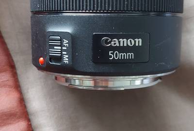 Canon 5D Mark III with 50 mm lens two batteries and a charger