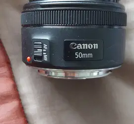 Canon 5D Mark III with 50 mm lens two batteries and a charger