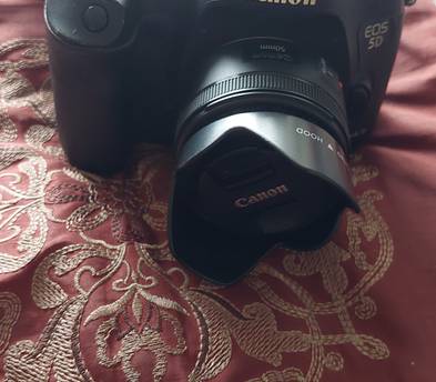 Canon 5D Mark III with 50 mm lens two batteries and a charger
