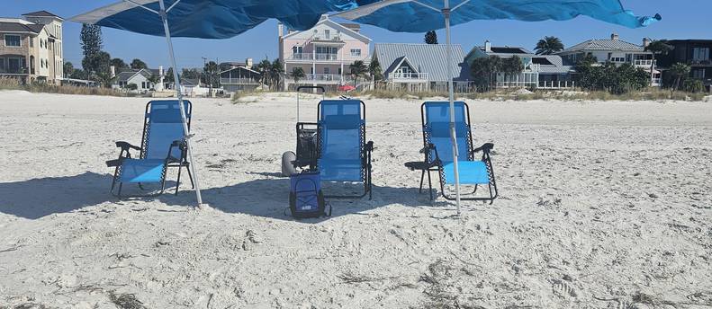 4 beach chairs  2 solbello shades, 1 beach dolly, 1 cooler, 1 Bluetooth speaker.