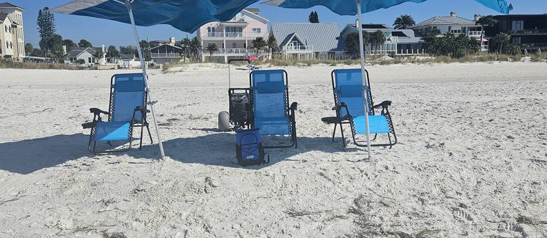 4 beach chairs  2 solbello shades, 1 beach dolly, 1 cooler, 1 Bluetooth speaker.