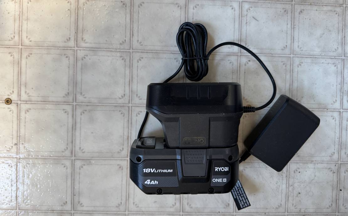 This is a Ryobi 18+ volt battery and charger.