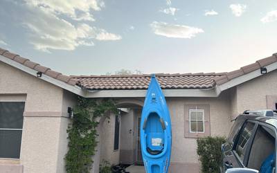 Kayak with paddler and life jacket
