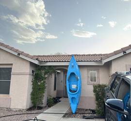 Kayak with paddler and life jacket