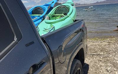 Kayak with paddler and life jacket
