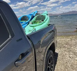 Kayak with paddler and life jacket