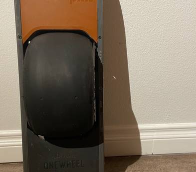 Onewheel Pint with Green Fender, Charger, and Helmet