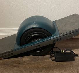 Onewheel Pint with Green Fender, Charger, and Helmet