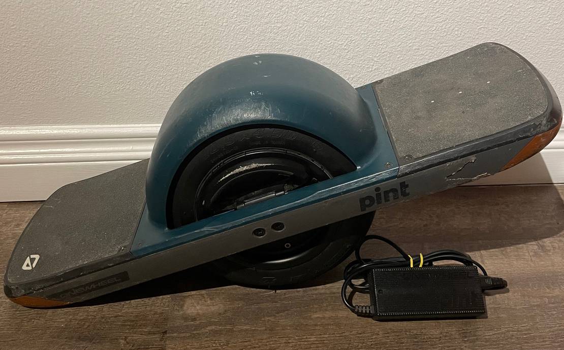 Onewheel Pint with Green Fender, Charger, and Helmet