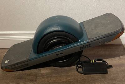 Onewheel Pint with Green Fender, Charger, and Helmet