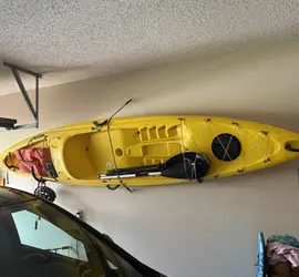 Sit on top kayak with paddle.