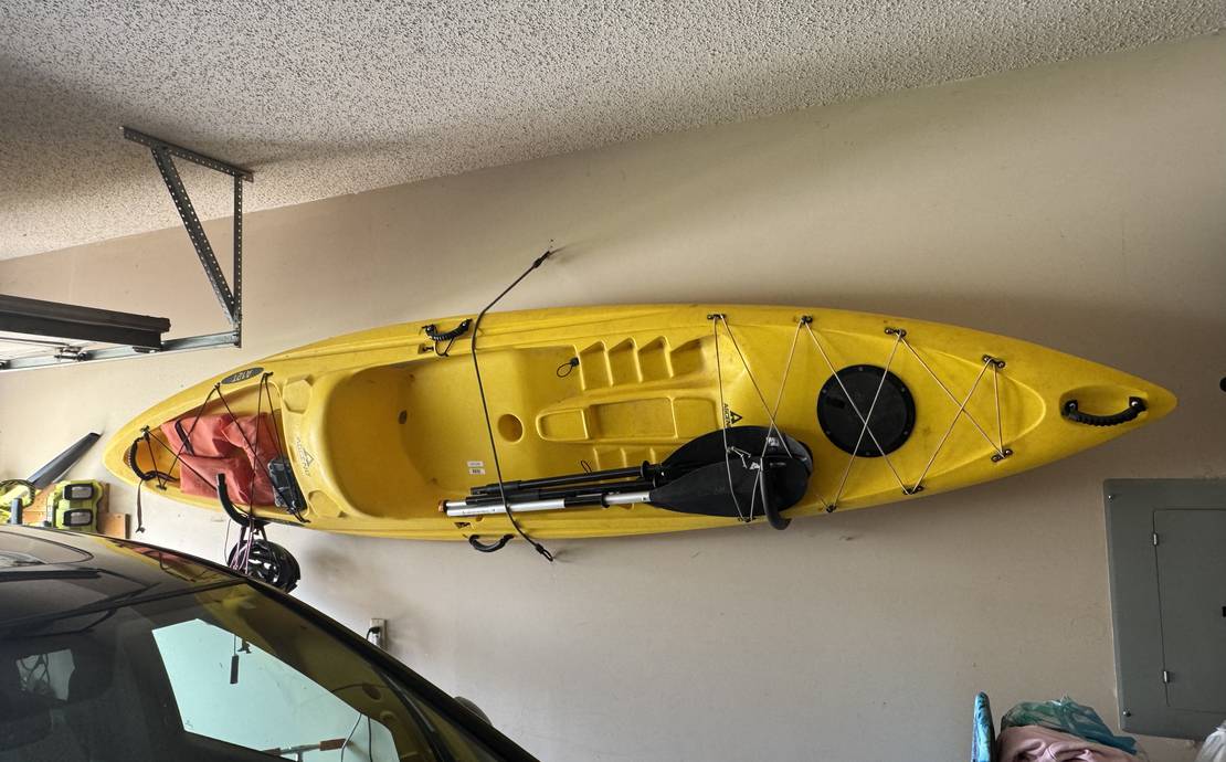 Sit on top kayak with paddle.