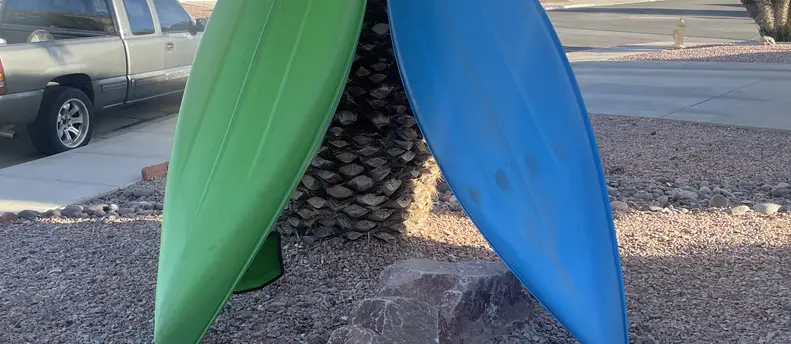 Kayak with paddler and life jacket
