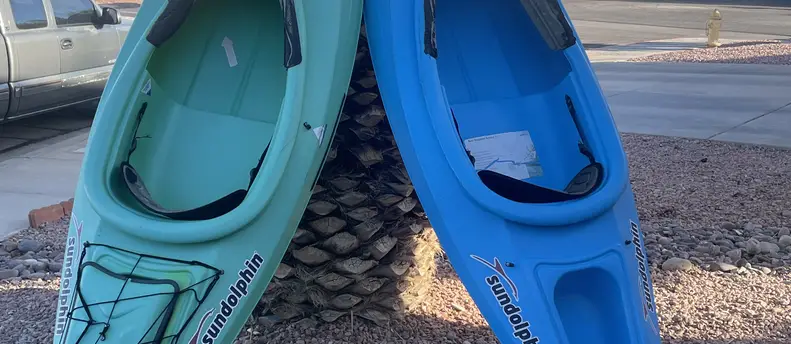 Kayak with paddler and life jacket