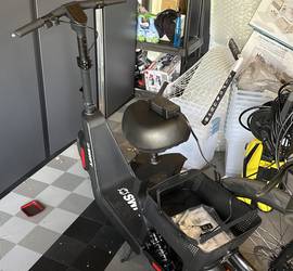 SWFT electric scooter with a seat and basket