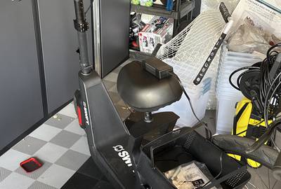SWFT electric scooter with a seat and basket