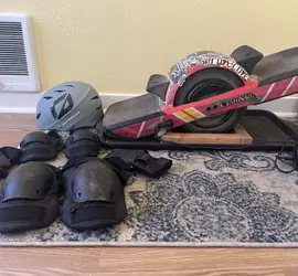Onewheel GT (w/ fender, treaded tire, flight fins, and protective gear)
